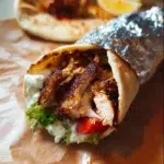 Delicious Chicken Shawarma served with fresh vegetables and sauces