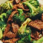 Traditional Chinese Beef and Broccoli served with rice on a plate
