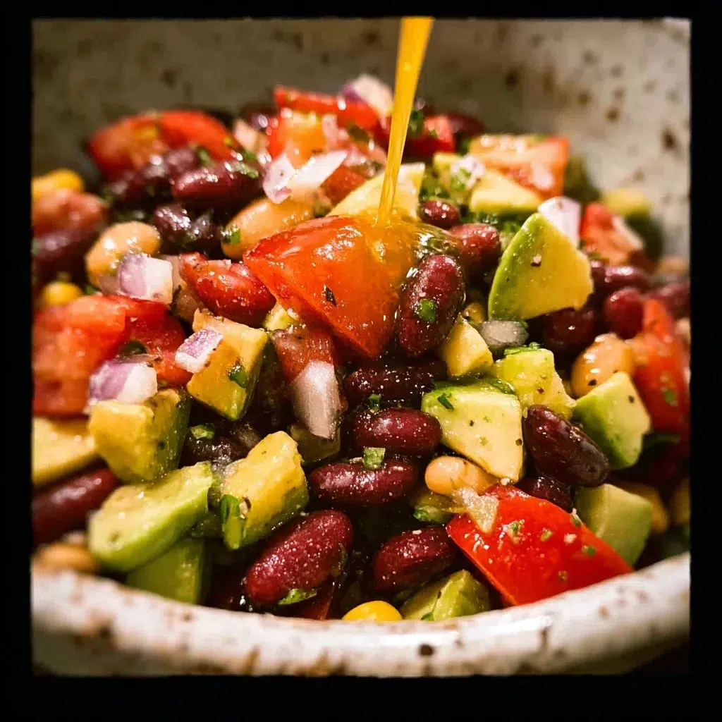 Colorful Cowboy Bean Salad with lime dressing, beans, and fresh vegetables.