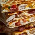 Delicious Easy Chicken Bacon Ranch Quesadilla with melted cheese and crispy bacon