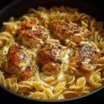 One-Pan Chicken served with Buttered Noodles on a plate