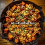 A savory BBQ chicken sweet potato skillet dish garnished with herbs.