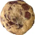 Batch of homemade soft cookies on a cooling rack, freshly baked and golden.