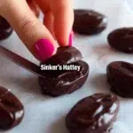 Chocolate peanut butter stuffed dates on a plate