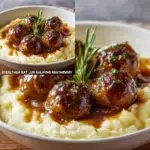 Creamy mushroom chicken meatballs in a savory sauce served on a plate