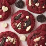Crushed Oreo Red Velvet Cookies topped with creamy frosting and Oreo crumbles