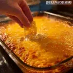 Delicious easy chicken enchilada dip served in a bowl with tortilla chips
