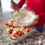 Layered strawberry banana delight dessert featuring fresh strawberries and bananas