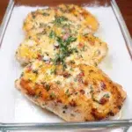 Perfectly cooked Million Dollar Baked Chicken Breast garnished for serving