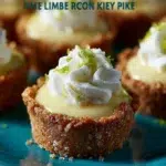 Delicious mini key lime pies served on a platter topped with whipped cream.