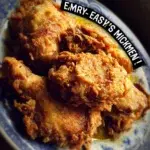 Plate of flavorful Mississippi Chicken garnished with herbs and served with sides.