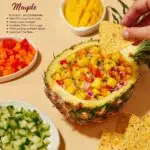 Fresh mango salsa served in a bowl with cilantro and lime
