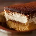 Tiramisu baked oats topped with cocoa powder and coffee for a delicious breakfast