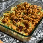 Chicken breast dish with roasted corn and avocado on a plate