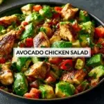 Bowl of healthy avocado chicken salad with fresh ingredients