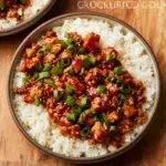 Plate of low carb firecracker ground chicken garnished with herbs