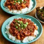 Meal Prep Chili Coconut Ground Chicken in a bowl with colorful vegetables