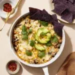 Salsa Verde Chicken and Rice Skillet dish topped with fresh herbs